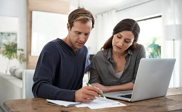couple looking at laptop computer